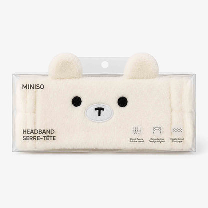 Cintillo de felpa Miniso para skincare y maquillaje, suave y absorbente, en diseño osito o rosa pastel.